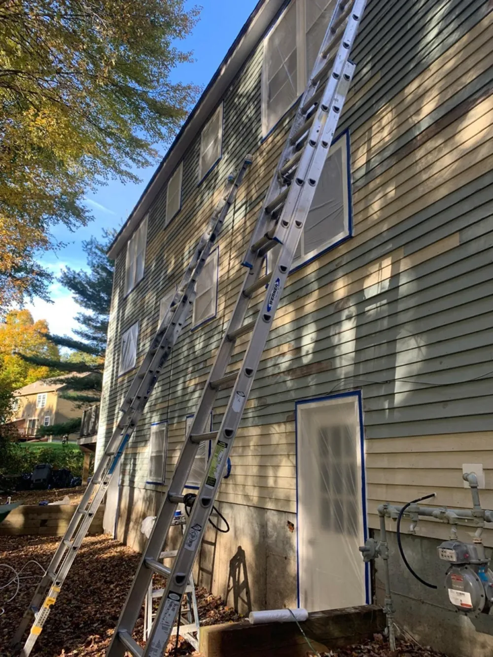 Accredited House Painting crew preparing an exterior in Greater Boston